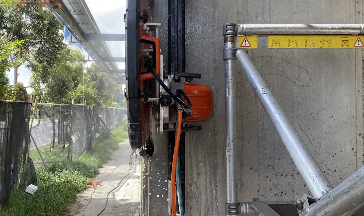 Wall saw cutting an opening in a concrete wall